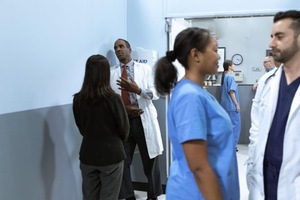Doctors discussing in hospital hallway