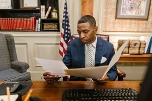 A professional sitting at his desk