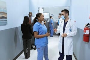 Doctors discussing in hospital hallway