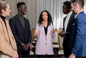 A group of people standing in a room