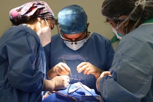 A group of surgeons performing a surgery