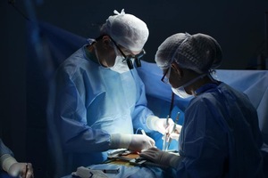 A group of surgeons performing surgery
