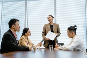 A person holding a piece of paper