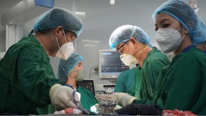 A group of surgeons working in a operating room