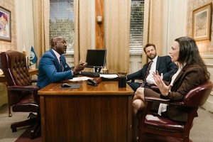 A group of people sitting around a table