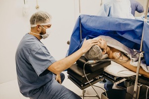 A doctor examining a patient