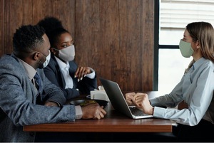 A group of people in a meeting