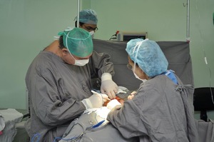 A group of surgeons performing surgery