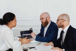 A group of people sitting at a table