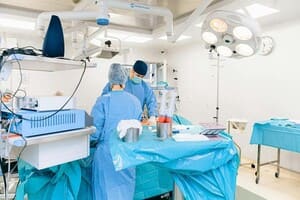 Two surgeons in scrubs operating