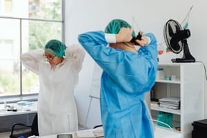 Two women in scrub suits